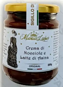 Vasetto in vetro della crema spalmabile al latte di asina Marialuisa, prodotta artigianalmente a Stigliano, Basilicata